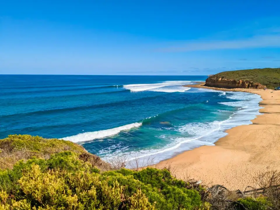 Waves rolling onto the sand along the Anglesea coast
