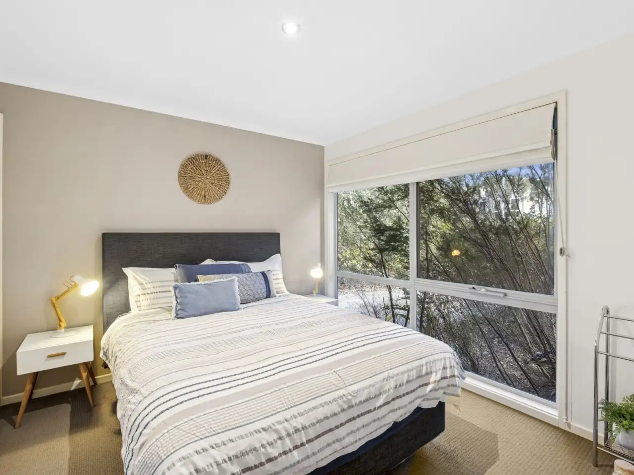 Bedroom with queen bed and garden outlook
